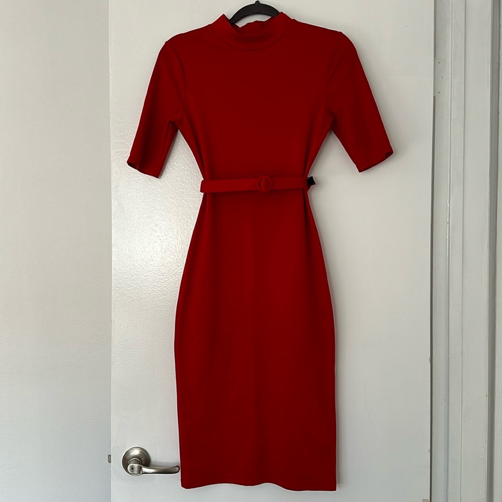 Red bodycon dress with minor turtle neck, mid sleeves, and belt.